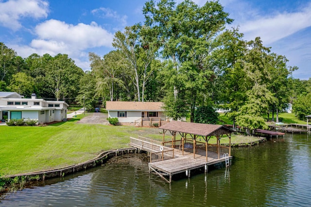 view of dock featuring a yard and a water view