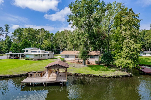 dock area with a water view and a yard