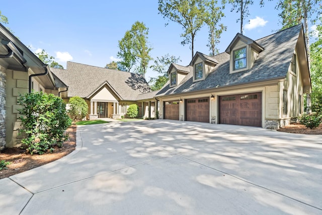 new england style home featuring a garage