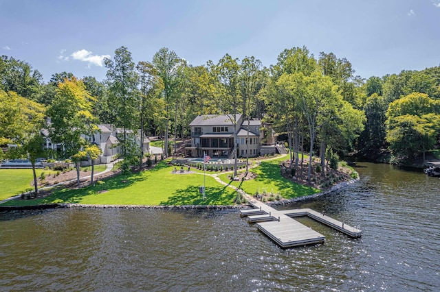 dock area featuring a yard and a water view