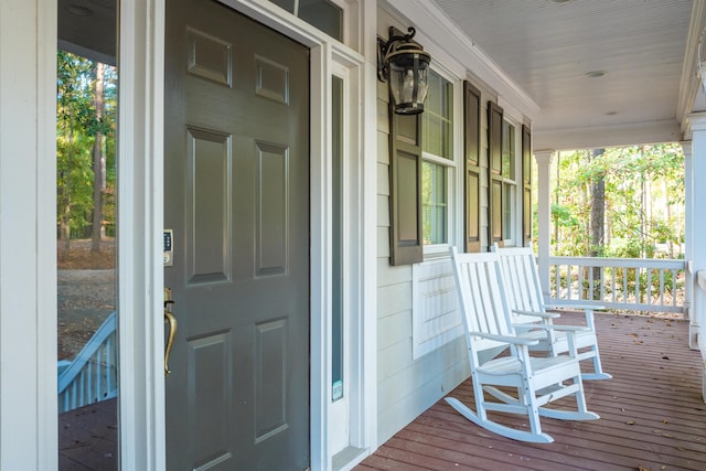 wooden terrace with a porch