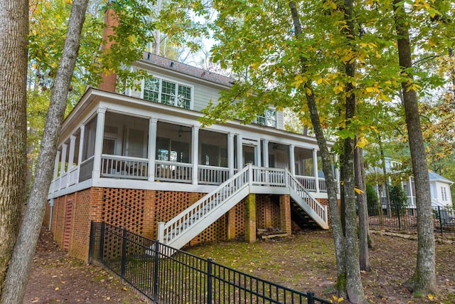 back of house with a sunroom