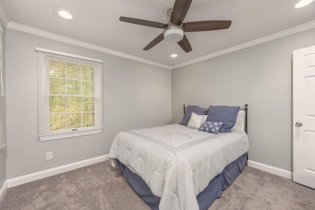 bedroom with ceiling fan, ornamental molding, and carpet flooring