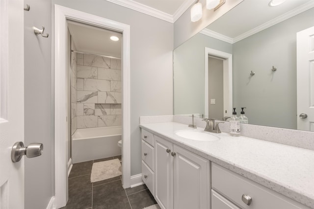 full bathroom featuring tiled shower / bath combo, vanity, toilet, crown molding, and tile patterned floors