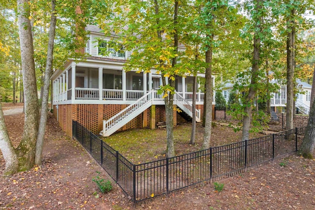 view of front of house with a sunroom