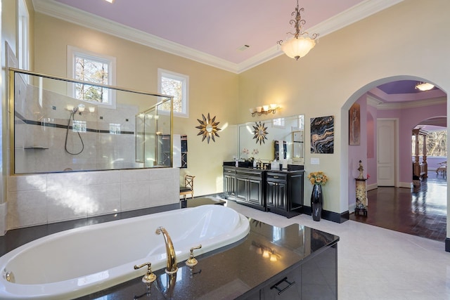 full bath featuring a shower with door, baseboards, a garden tub, and crown molding