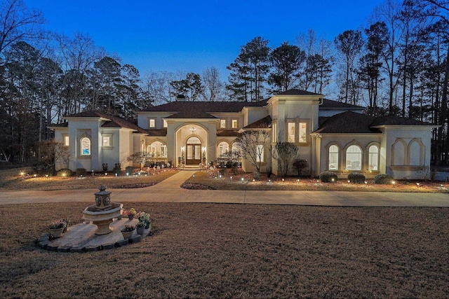 view of building exterior with driveway