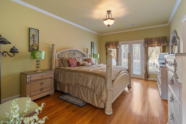 bedroom featuring crown molding, access to outside, visible vents, and light wood finished floors