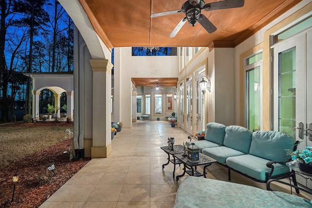 view of patio / terrace featuring french doors, ceiling fan, and outdoor lounge area