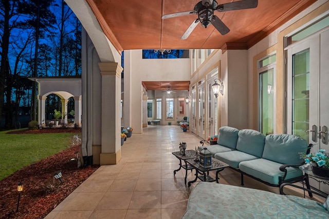 view of patio with an outdoor living space, french doors, and ceiling fan