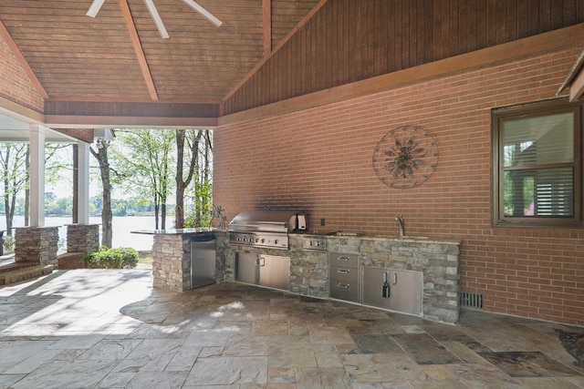 view of patio with an outdoor kitchen and area for grilling