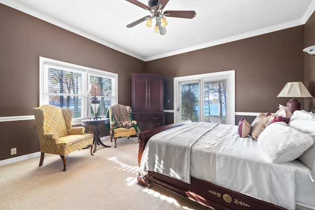 bedroom featuring crown molding, multiple windows, and carpet