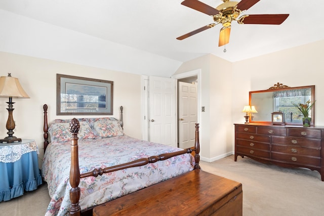 bedroom with light colored carpet, baseboards, ceiling fan, and vaulted ceiling