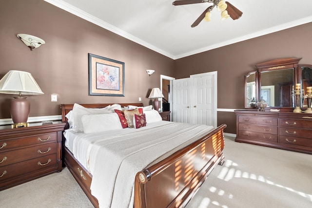 bedroom featuring crown molding, light carpet, and a ceiling fan