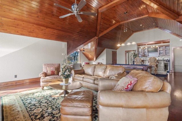 living area with vaulted ceiling with beams, a ceiling fan, wooden ceiling, and wood finished floors