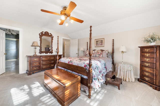 bedroom with baseboards, ceiling fan, carpet flooring, and lofted ceiling