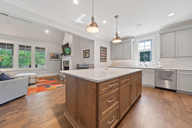 1041 Club Pointe Cir, Greensboro, GA 30642 - kitchen with dishwasher, open floor plan, recessed lighting, tasteful backsplash, and wood-type flooring
