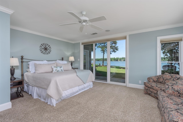 bedroom featuring ornamental molding, a water view, and access to exterior