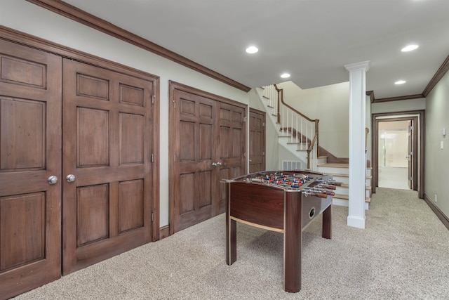 playroom featuring ornamental molding and light carpet