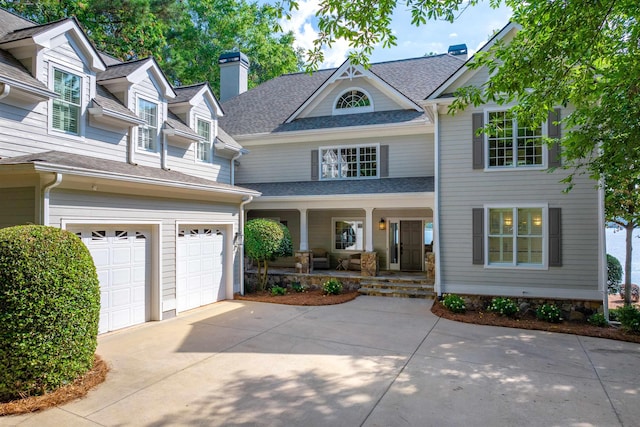 view of front of property with a garage and a porch