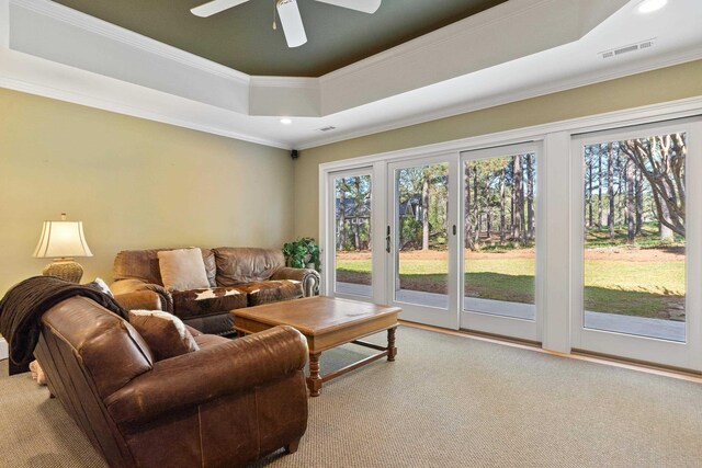 100 Indian Trl, Eatonton, GA 31024 - living area with a tray ceiling, a healthy amount of sunlight, and crown molding