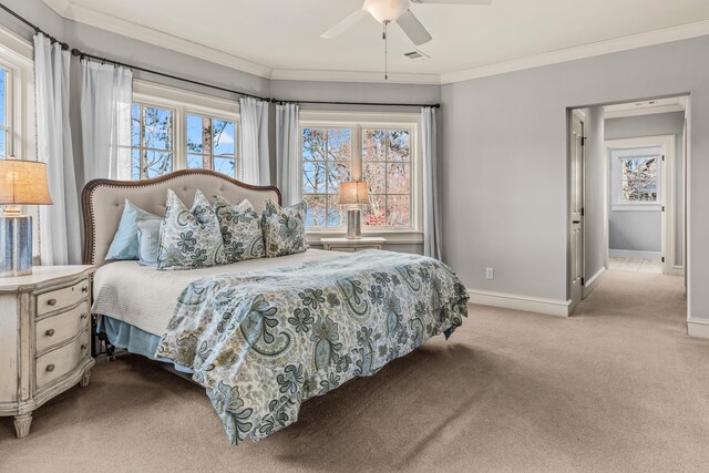 bedroom with visible vents, carpet flooring, multiple windows, and ornamental molding