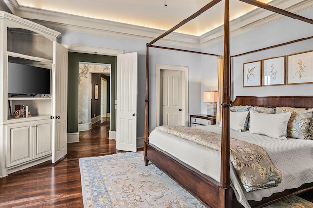 bedroom with baseboards, dark wood-style floors, and ornamental molding