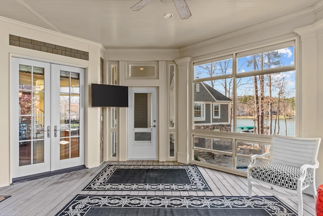 sunroom / solarium with french doors and ceiling fan