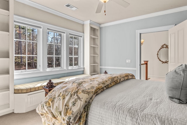 bedroom featuring visible vents, light carpet, ornamental molding, and a ceiling fan