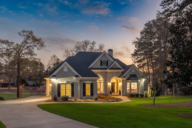 view of front of house with a yard