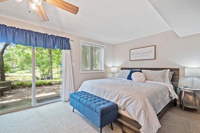 bedroom featuring access to outside, ceiling fan, and carpet flooring