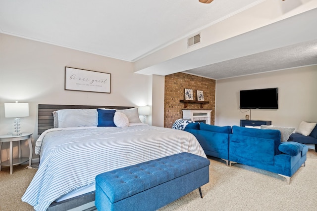 bedroom with crown molding, a large fireplace, and carpet floors