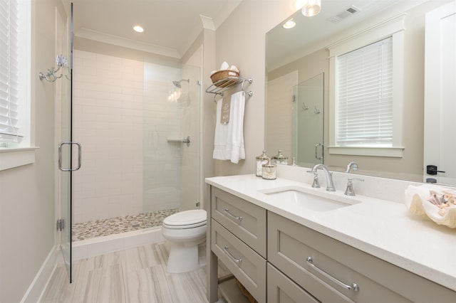 full bathroom with a stall shower, toilet, vanity, recessed lighting, and ornamental molding