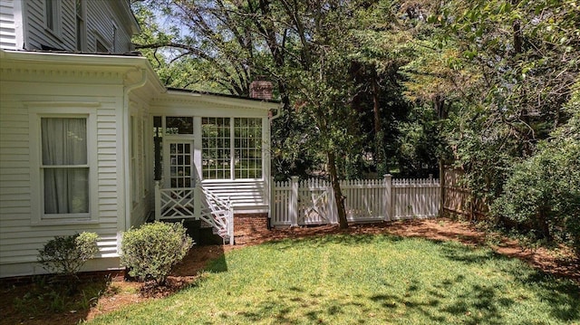 view of yard with a sunroom