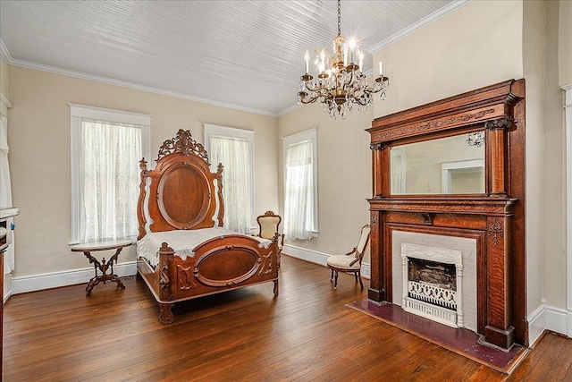 living area with an inviting chandelier, crown molding, a fireplace, and dark hardwood / wood-style floors