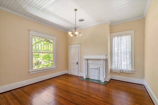 unfurnished living room featuring ornamental molding, wood-type flooring, and a notable chandelier