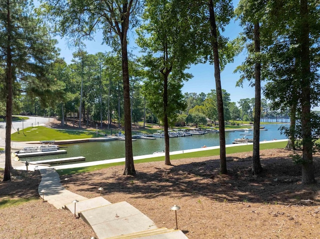 surrounding community featuring a water view