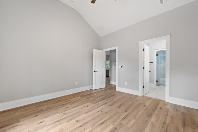 103 Spruce Ln, Eatonton, GA 31024 - unfurnished bedroom featuring high vaulted ceiling, light wood-style flooring, ensuite bathroom, a ceiling fan, and baseboards