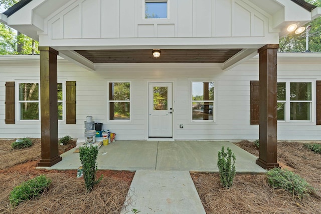 103 Spruce Ln, Eatonton, GA 31024 - entrance to property featuring board and batten siding and a patio