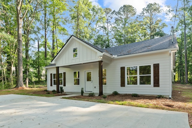 103 Spruce Ln, Eatonton, GA 31024 - modern farmhouse style home featuring board and batten siding, a patio, and a shingled roof