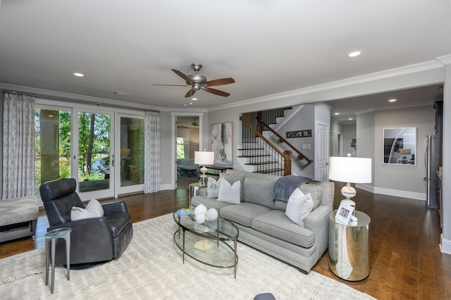 living room with crown molding and dark wood-type flooring