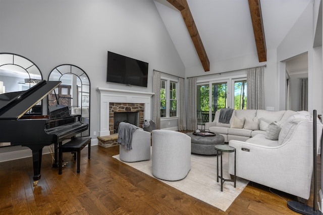 living room with hardwood / wood-style flooring, a fireplace, high vaulted ceiling, and beamed ceiling