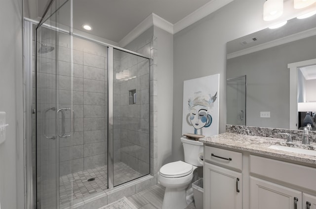 bathroom featuring ornamental molding, toilet, a shower with door, and vanity