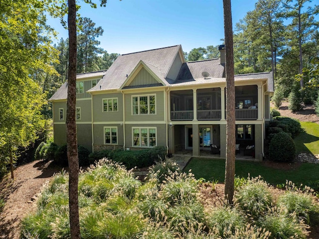 back of property featuring a sunroom