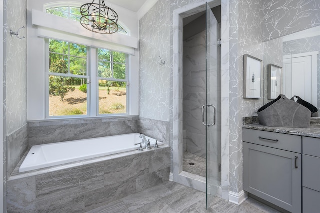 bathroom featuring vanity and separate shower and tub