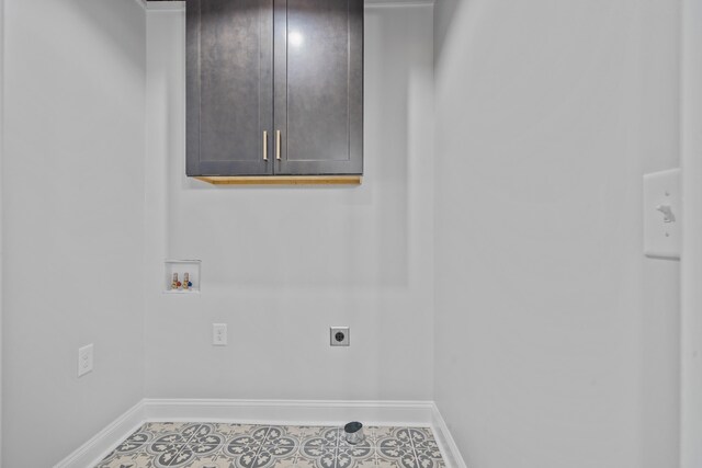 291 Power Point Rd, Milledgeville, GA 31061 - laundry room with cabinet space, hookup for an electric dryer, washer hookup, and tile patterned floors