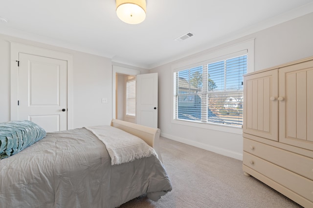 bedroom featuring light colored carpet and ornamental molding