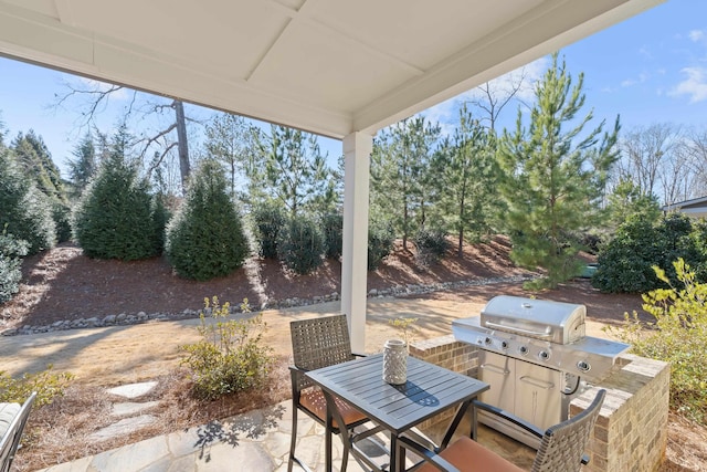 view of patio with a grill