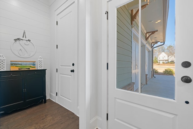 entryway with dark hardwood / wood-style floors