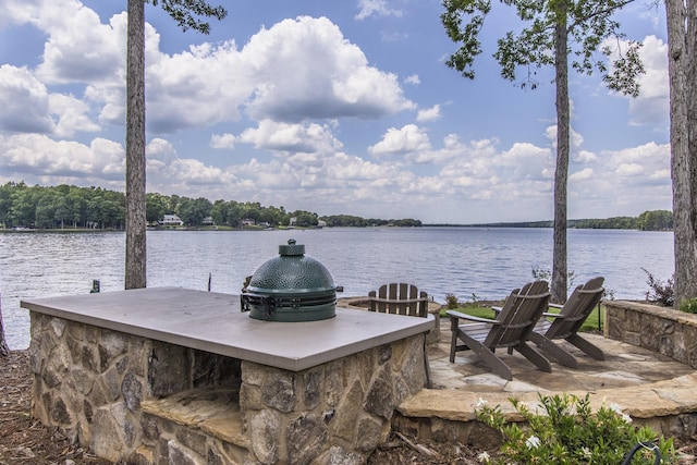 view of dock with a water view and an outdoor bar